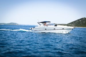 Motorboat in the water. Maintenance ensures your boat will last longer and perform better!